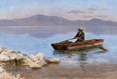 Мужчина в лодке на озере